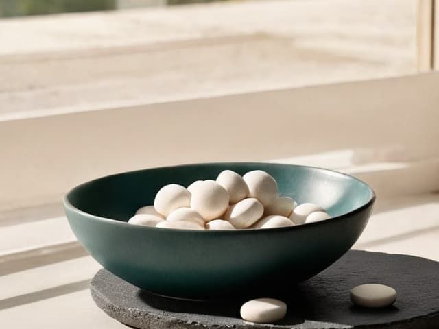 Small softgels beside a sunlit window